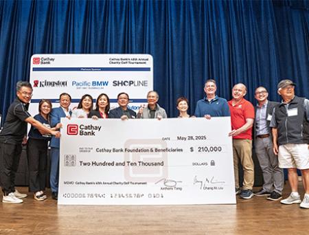 nationalprimepay Bank presents a $210,000 check to representatives from local nonprofits who will benefit from the funds raised at the bank’s golf tournament event.